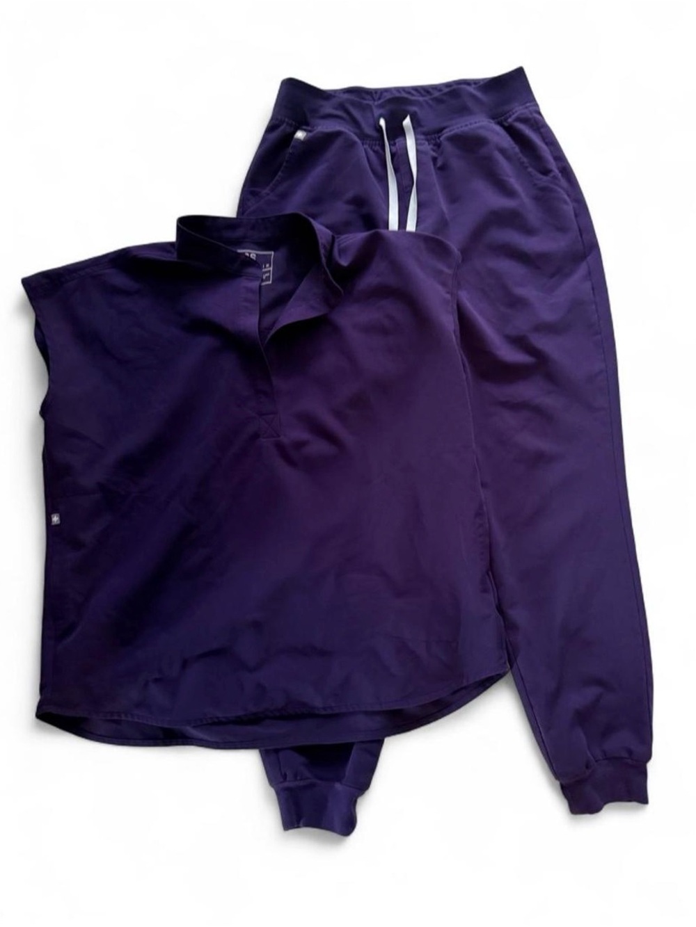 FIGS scrub set in Purple Jam. Top is Rafaela, bottoms are Zamora joggers